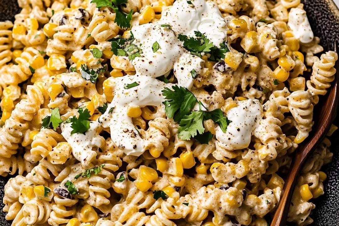 This Mexican Street Corn Pasta Salad is a zesty and flavorful fusion of pasta and elote flavors. With creamy Cotija cheese, fire-roasted corn, and a tangy lime dressing, this salad is the perfect side dish for summer barbecues or gatherings. It's easy to make, deliciously seasoned, and sure to be a crowd-pleaser.