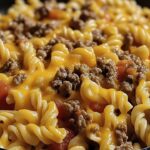 This Cheesy Beef Taco Pasta combines the rich flavors of taco seasoning with the creamy goodness of Velveeta and cheddar cheese. It’s a hearty and satisfying dish that's perfect for weeknight dinners or gatherings with friends and family!