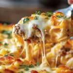 This Sour Cream Noodle Bake is a comforting, cheesy casserole that's perfect for a family dinner. With layers of tender egg noodles, savory beef sauce, and a creamy, tangy noodle mixture, this dish is sure to be a hit.