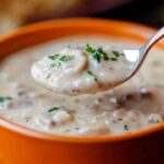 This Creamy Mushroom Soup is the ultimate comfort food for cozy nights. Earthy mushrooms, garlic, and a touch of cream all come together to make a rich, velvety soup that's perfect with a slice of crusty bread. Every time I make this, my family ends up scraping the bowl clean. So, if you're craving a warm, hearty soup that tastes like pure magic, this is it!